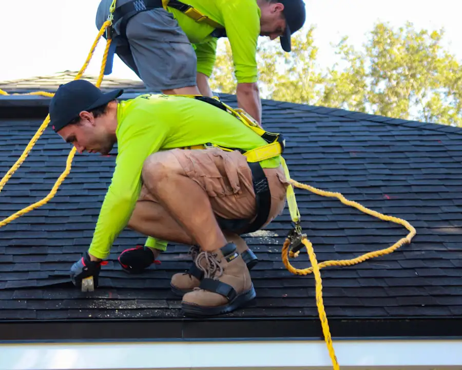 Roofers working on a pitched roof
